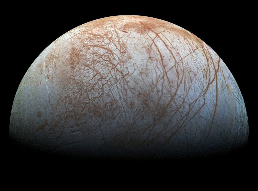 Europa’s Ice Shell May Hide Shallow Briny Pockets icy cracked surface of Jupiter moon Europa